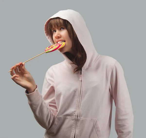 Beautiful teenage girl with lollipop — Stock Photo, Image