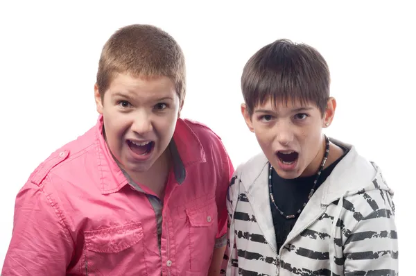 Two teenage boys shouting and screaming in surprise — Stock Photo, Image