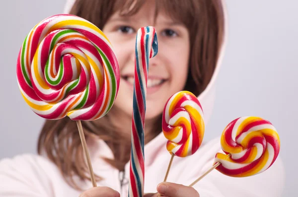 Beautiful teenage girl with lollipops — Stock Photo, Image