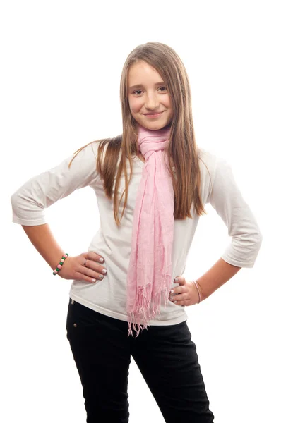 Beautiful teenage girl smiling while posing against the white background — Stock Photo, Image
