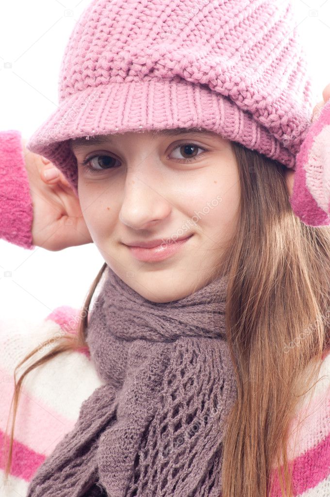 Beautiful teenage girl wearing fashionable cap, sweater and scarf ...