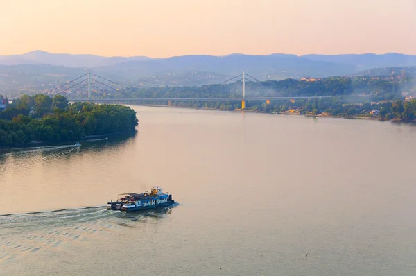 stock image Small ship slowly takes his cargo down the river Danube