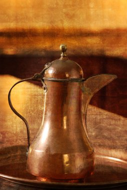 Antique copper jug with grunge background clipart
