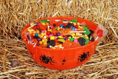 Bowl of mixed halloween candy clipart