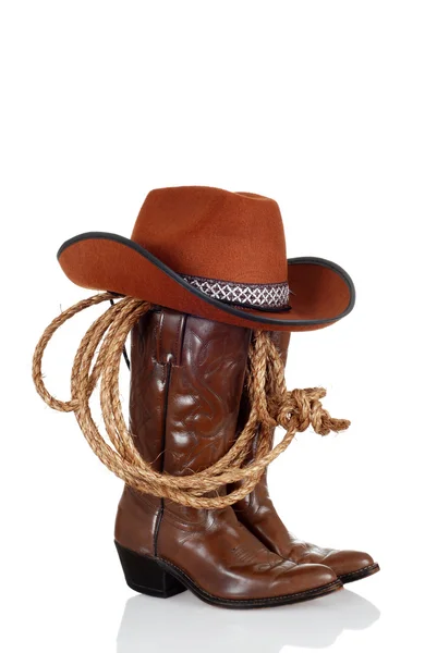 Cowboy boots with hat and a lasso — Stock Photo, Image