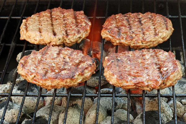 Hamburgerek a grill — Stock Fotó