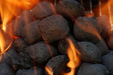 Macro charcoal barbecue briquettes clipart