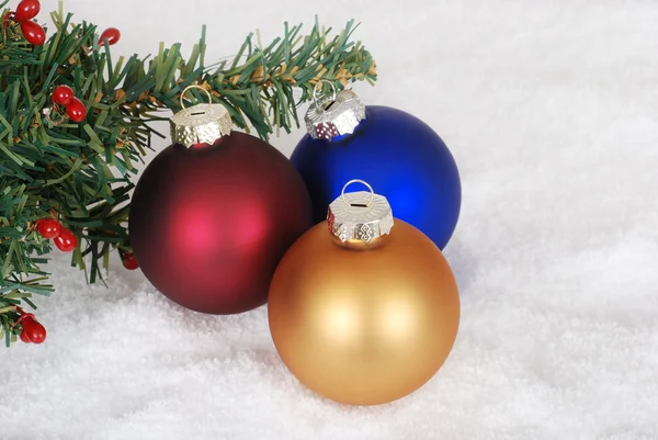 Christmas ornaments and tree branch — Stock Photo, Image