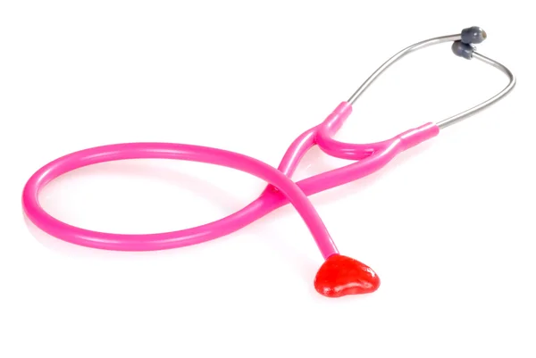 Pink stethoscope with candy heart — Stock Photo, Image
