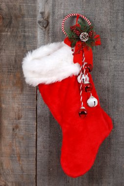 Christmas sock and decoration on wood clipart