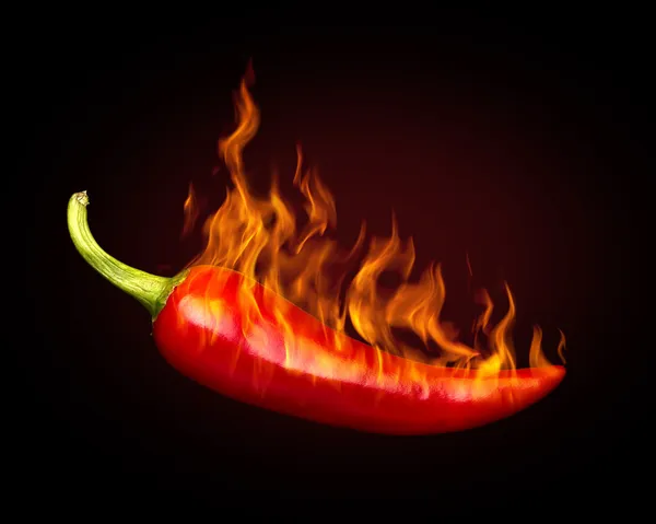 Pimenta quente vermelha no fundo preto com chama — Fotografia de Stock