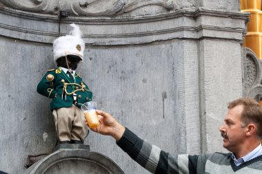 Manneken Pis dressed in uniform clipart