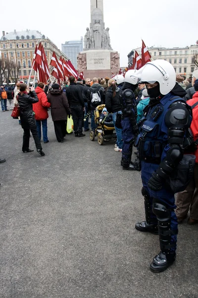 Riot police in crowd — Stock Photo, Image