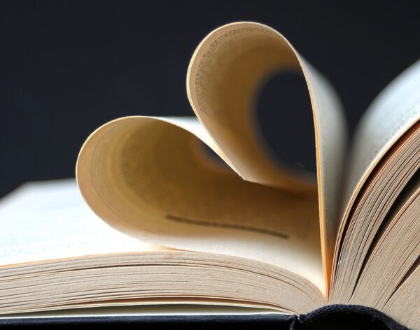 Pages of a book curved into a heart