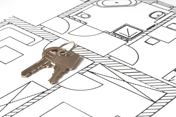 Hus nyckel på en plan — Stockfoto