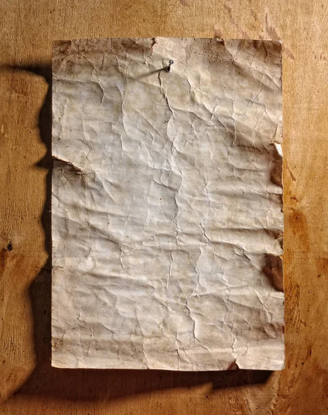 Papel velho sobre madeira — Fotografia de Stock