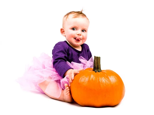 Baby girl in costume with halloween pumpkin Stock Photo