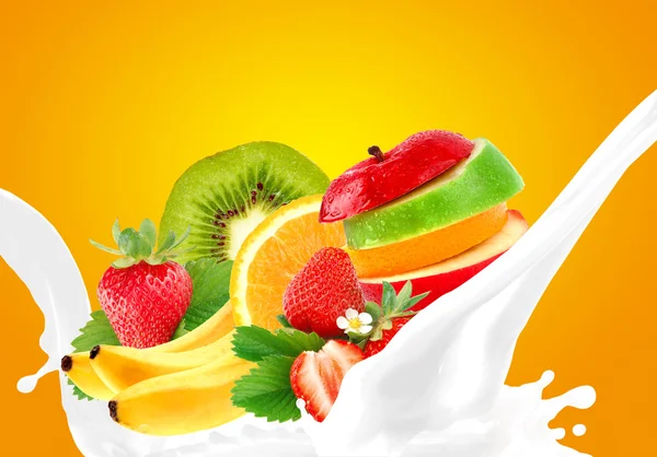 Splashing milk with fruit mix — Stock Photo, Image