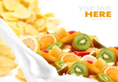 Milk splash with fruit mix on corn flakes background