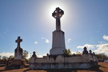 Celtic cross on old graveyard clipart