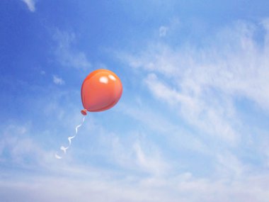 Single orange balloon in the blue sky clipart