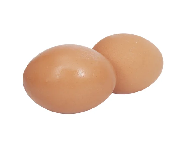 Dwa brązowe jaja na białym tle — Zdjęcie stockowe