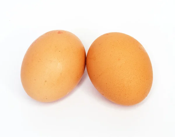 Dvě vejce na bílém pozadí — Stock fotografie