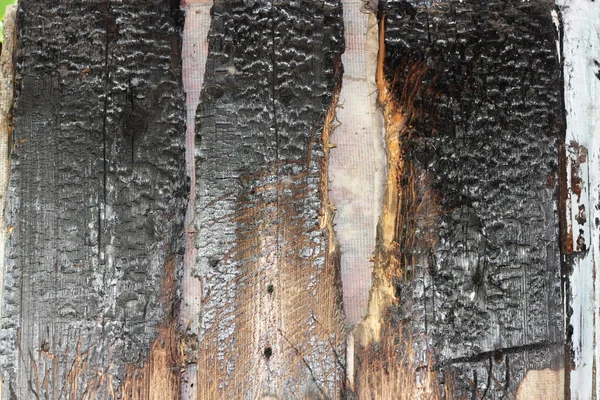 Oude houten achtergrond van het advies na brand — Stockfoto