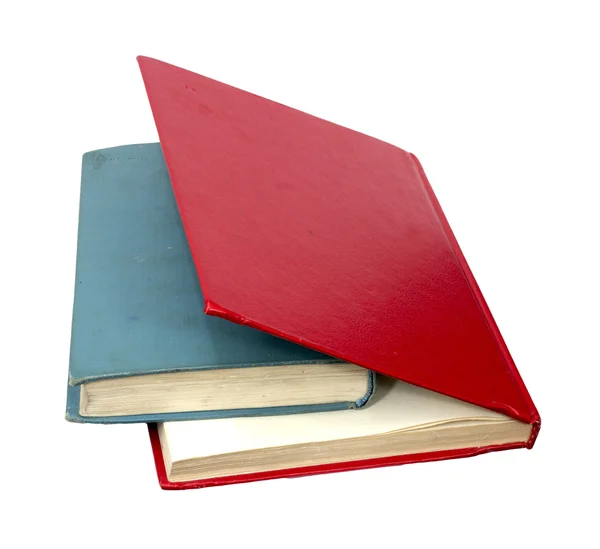 Fechado livros vermelhos e azuis sobre um fundo branco refletindo — Fotografia de Stock