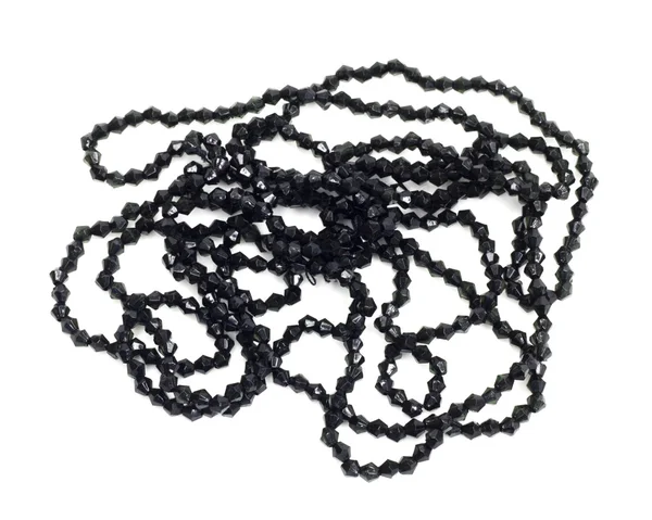 Черное ожерелье с маленькими бриллиантами на белой спине — стоковое фото