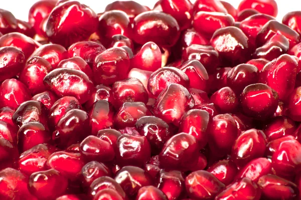 Extremo primer plano fondo de una fruta de granada madura jugosa roja —  Fotos de Stock