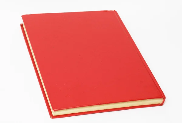 Röd bok på vit bakgrund — Stockfoto