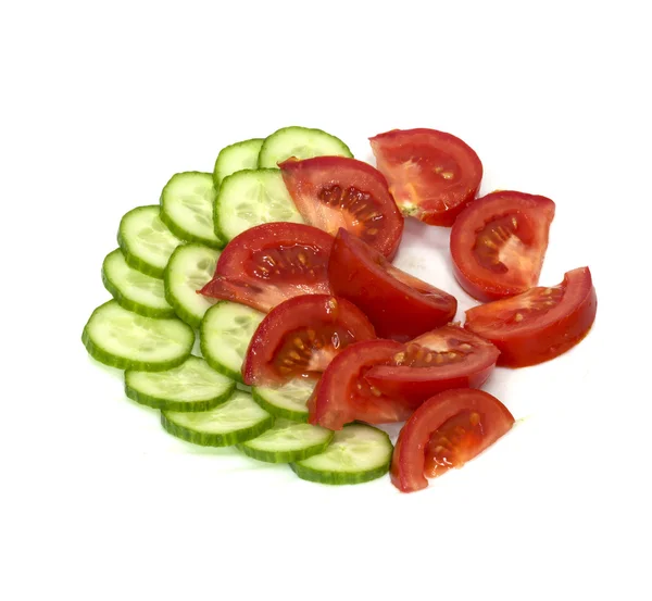 Tomatoes and cucumbers on white background — Stock Photo, Image