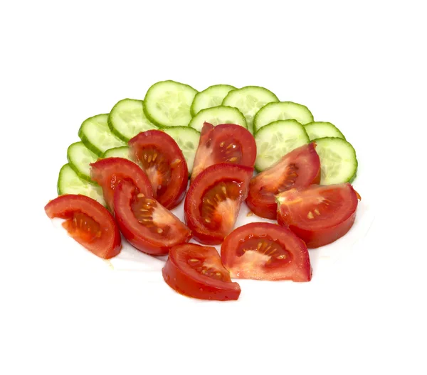 Tomatoes and cucumbers on white background — Stock Photo, Image