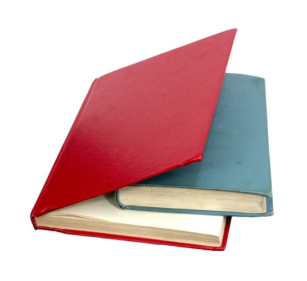 Libros rojos y azules cerrados sobre un fondo blanco reflectante —  Fotos de Stock