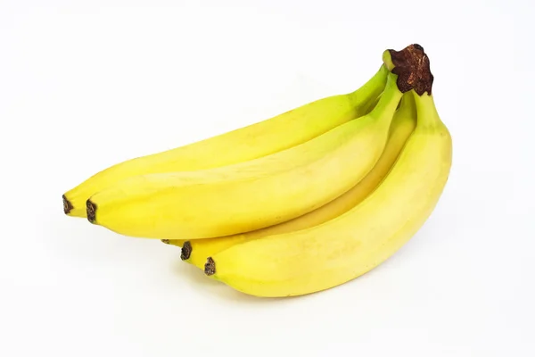 Foto de um molho de bananas em um fundo branco — Fotografia de Stock