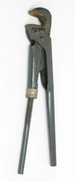 Старый регулируемый гаечный ключ под белым фоном — стоковое фото