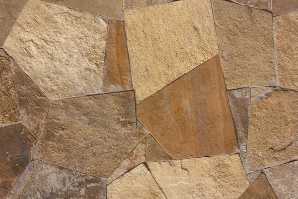 Unshaped stone wall pattern, wall made of rocks — стоковое фото