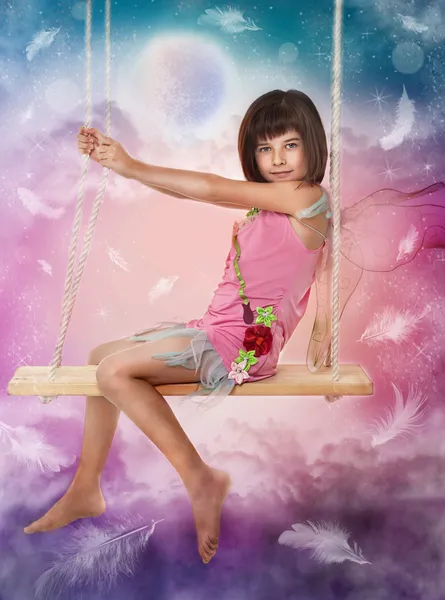 stock image Little girl sitting on the swing