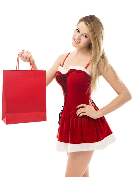 Retrato de uma mulher de Natal no chapéu de Papai Noel segurando um comercial ba — Fotografia de Stock