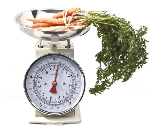 stock image Old style kitchen scales with carrots on white background Isolat