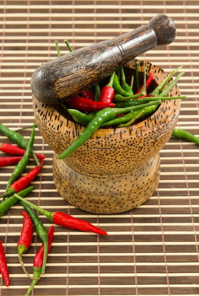 stock image Chilies in wooden mortar