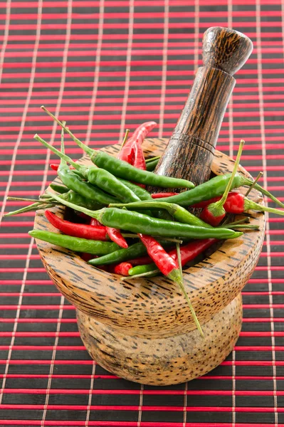 Wooden mortar with chili — Stock Photo, Image
