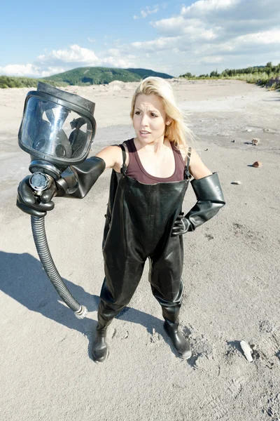 stock image Woman with gas mask wearing protective clothes