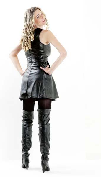 Woman wearing black dress and black boots — Stock Photo, Image