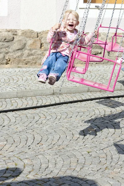 Little girl on carousel — Stock Photo, Image