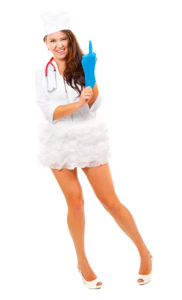Giovane infermiera mostrando dito medio — Foto Stock