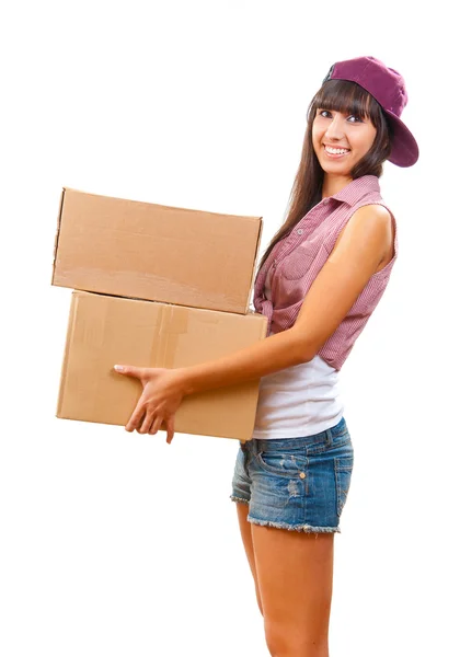 Молодая девушка с картонными коробками — стоковое фото