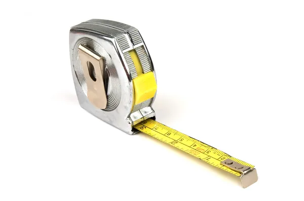 Измерение инструмента желтой ленты на белом фоне — стоковое фото