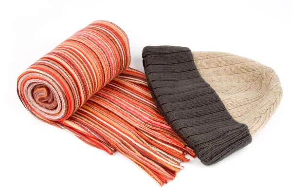 Tortile multicolor wool scarf and cap over white background — Stock Photo, Image